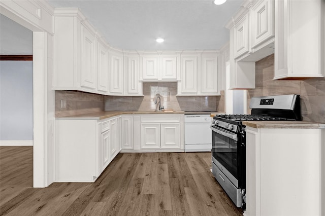 331 Terminal St, Houston, TX 77020 - kitchen with light wood-type flooring, a sink, dishwasher, and gas stove