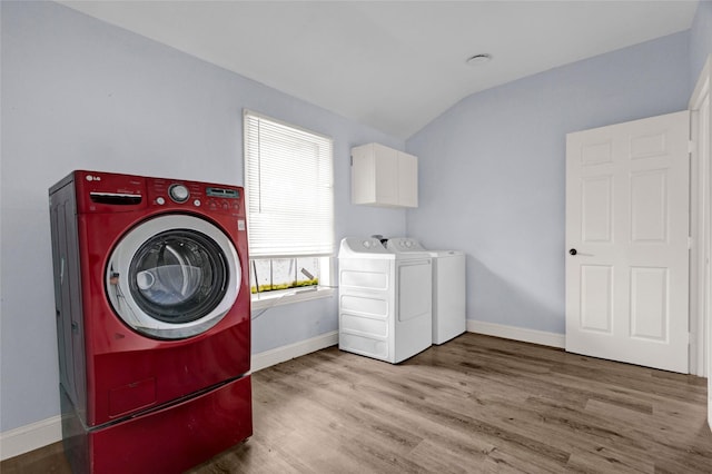 331 Terminal St, Houston, TX 77020 - laundry room featuring baseboards, cabinet space, independent washer and dryer, and wood finished floors