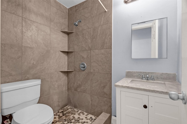 331 Terminal St, Houston, TX 77020 - bathroom featuring vanity, toilet, and tiled shower