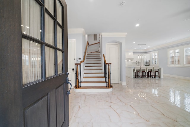 foyer with crown molding, stairs, baseboards, marble finish floor, and recessed lighting