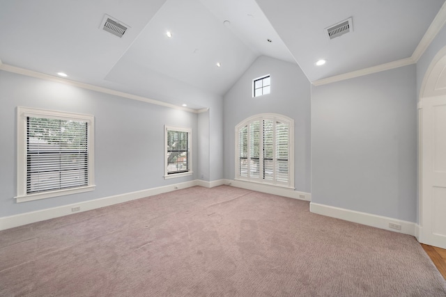 unfurnished room featuring crown molding, plenty of natural light, and visible vents