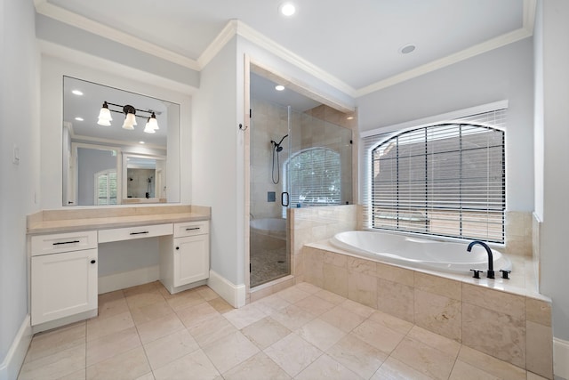bathroom with crown molding, vanity, a shower stall, and a garden tub
