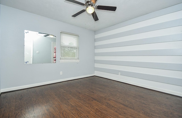 709 N Rivershire Dr, Conroe, TX 77304 - empty room with baseboards, a ceiling fan, and dark wood finished floors