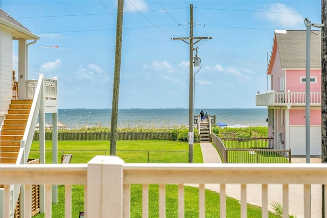 property view of water with stairway and fence