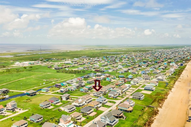 drone / aerial view with a water view and a residential view