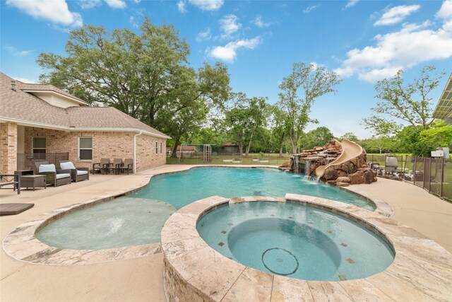 6820 Cemetary Rd, Manvel, TX 77578 - view of pool featuring a patio, a pool with connected hot tub, and fence