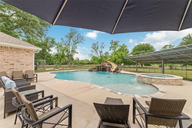 6820 Cemetary Rd, Manvel, TX 77578 - view of swimming pool with a pool with connected hot tub, fence, and a patio area