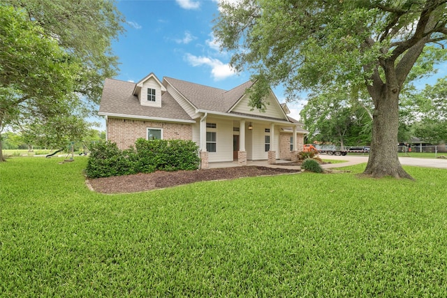 6820 Cemetary Rd, Manvel, TX 77578 - view of front of property with brick siding, a front lawn, and roof with shingles