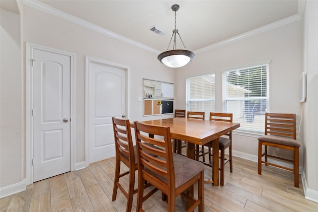 6820 Cemetary Rd, Manvel, TX 77578 - dining space featuring crown molding, light wood-style floors, and baseboards