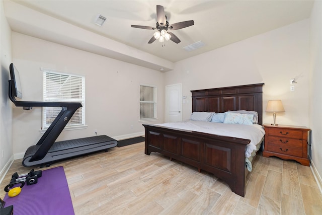 6820 Cemetary Rd, Manvel, TX 77578 - bedroom featuring baseboards, light wood finished floors, and ceiling fan
