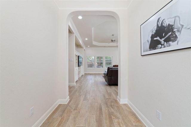 6820 Cemetary Rd, Manvel, TX 77578 - hallway with light wood-type flooring, arched walkways, recessed lighting, and baseboards