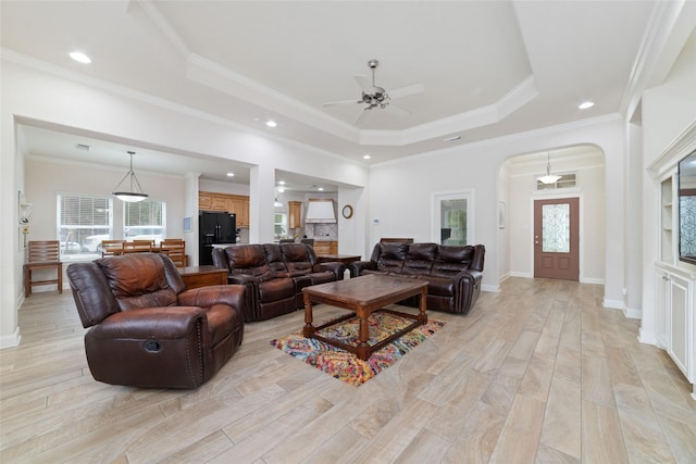 6820 Cemetary Rd, Manvel, TX 77578 - living area with arched walkways, a ceiling fan, a raised ceiling, recessed lighting, and ornamental molding