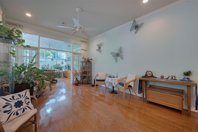 interior space with crown molding, visible vents, wood finished floors, recessed lighting, and a ceiling fan