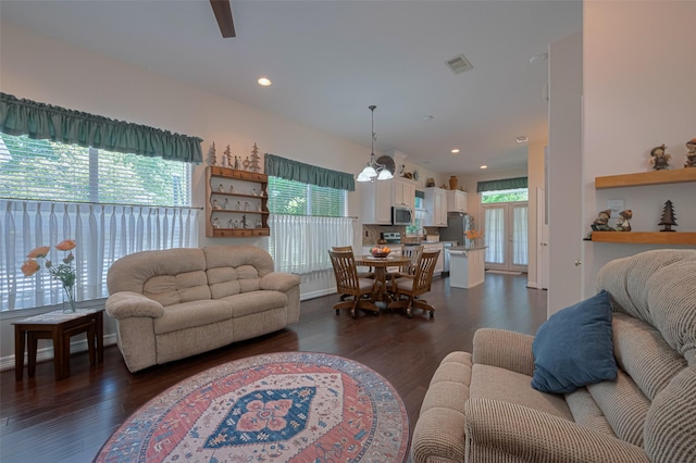 living area with visible vents, recessed lighting, ceiling fan, and dark wood-style floors