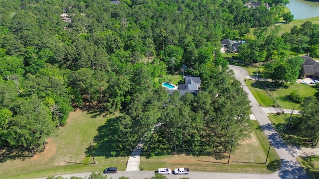 drone / aerial view with a view of trees