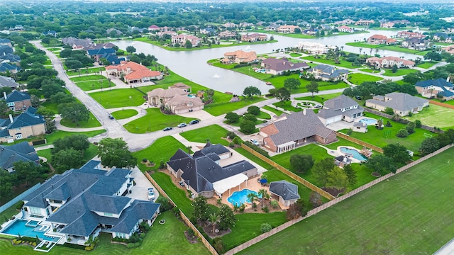 aerial view featuring a water view and a residential view
