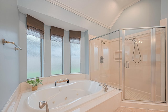 full bathroom featuring a shower stall, a healthy amount of sunlight, and a jetted tub