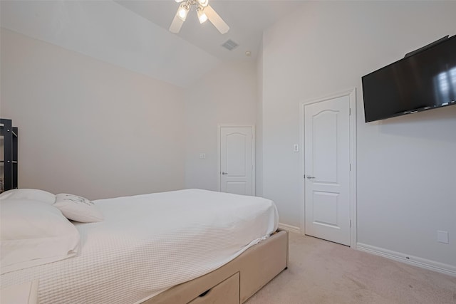 bedroom with visible vents, baseboards, high vaulted ceiling, light colored carpet, and a ceiling fan