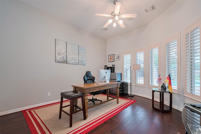 office area featuring baseboards, ceiling fan, dark wood-style flooring, and visible vents