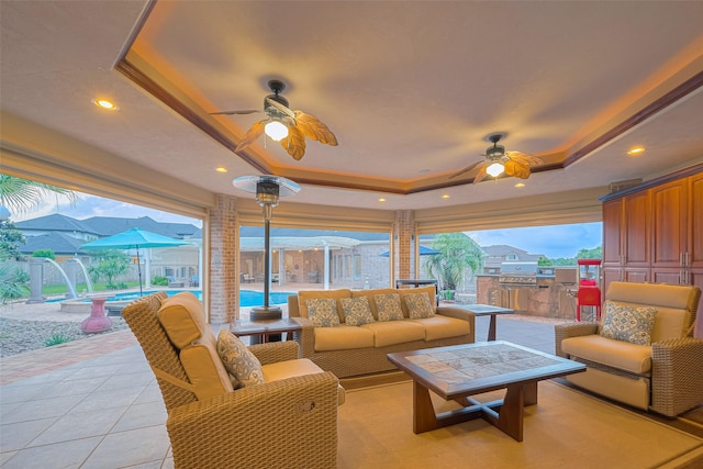 view of patio / terrace with an outdoor hangout area, a ceiling fan, fence, and an outdoor pool