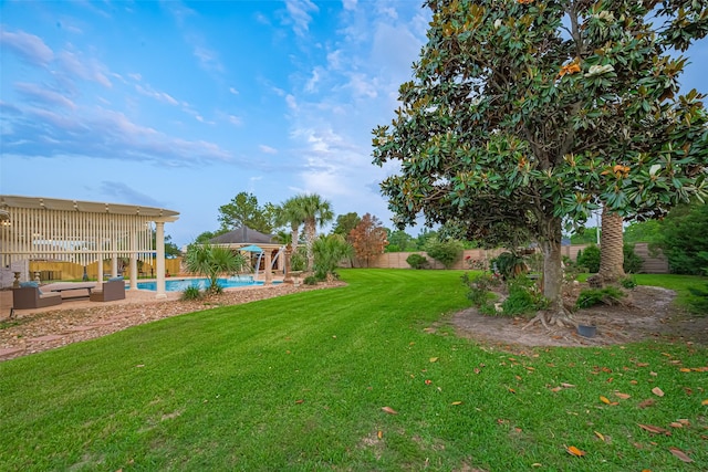 view of yard with an outdoor hangout area, a fenced in pool, a fenced backyard, and a patio