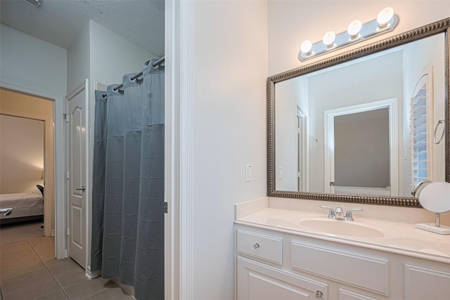full bath featuring a shower with curtain, tile patterned flooring, and vanity