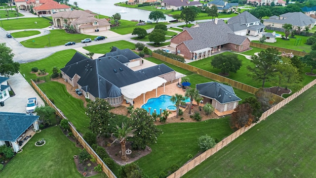 aerial view featuring a water view and a residential view