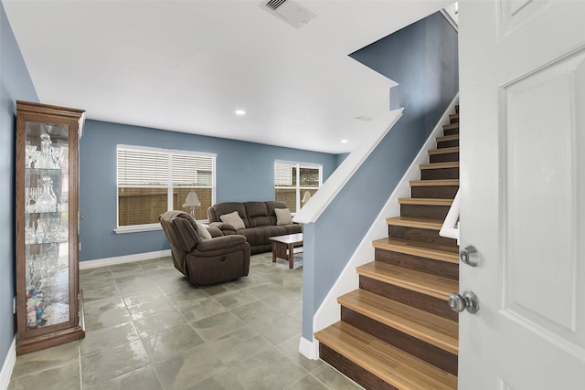 stairs with visible vents, recessed lighting, and baseboards