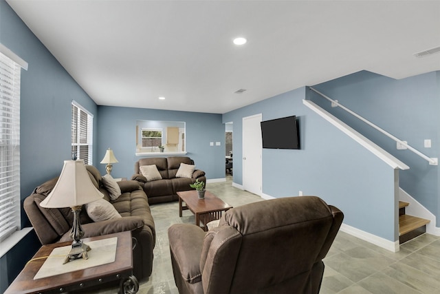 living area featuring stairway, baseboards, recessed lighting, and visible vents