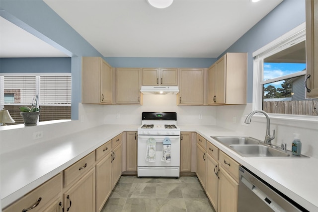 kitchen featuring under cabinet range hood, light brown cabinets, white range with gas stovetop, and dishwasher