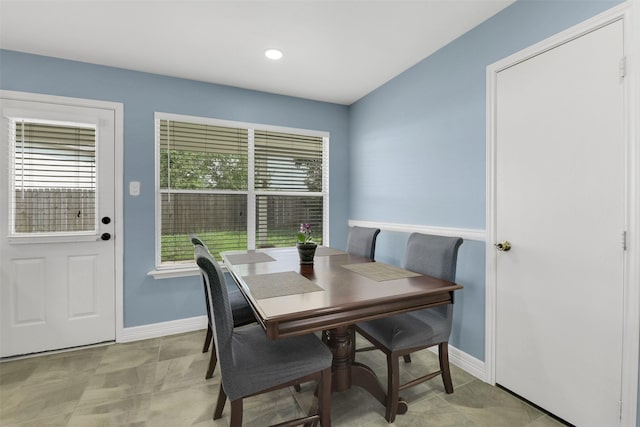 dining area featuring baseboards