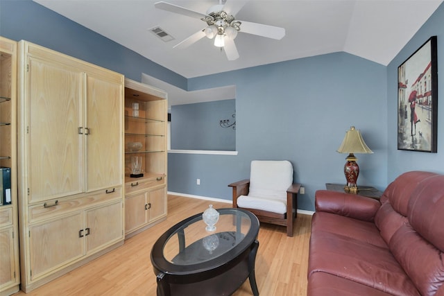 living room with baseboards, ceiling fan, visible vents, and light wood-style flooring