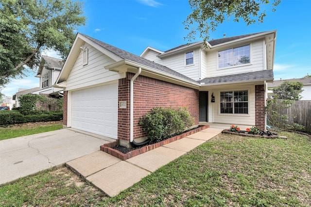 traditional-style house with fence, a front lawn, brick siding, a garage, and concrete driveway