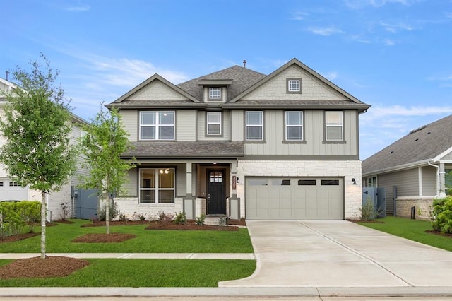 32307 Fly Fish Way, Fulshear, TX 77441 - craftsman inspired home featuring a garage, driveway, stone siding, and a front lawn