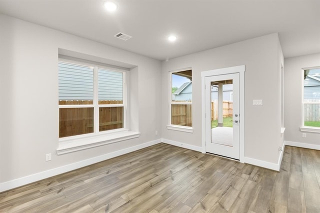 32307 Fly Fish Way, Fulshear, TX 77441 - interior space featuring recessed lighting, baseboards, visible vents, and wood finished floors
