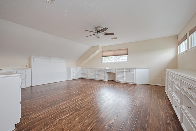 14811 El Miranda Dr, Houston, TX 77095 - additional living space with ceiling fan, vaulted ceiling, dark wood finished floors, and visible vents