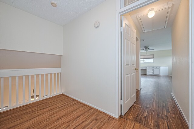 14811 El Miranda Dr, Houston, TX 77095 - hall featuring baseboards, attic access, and wood finished floors