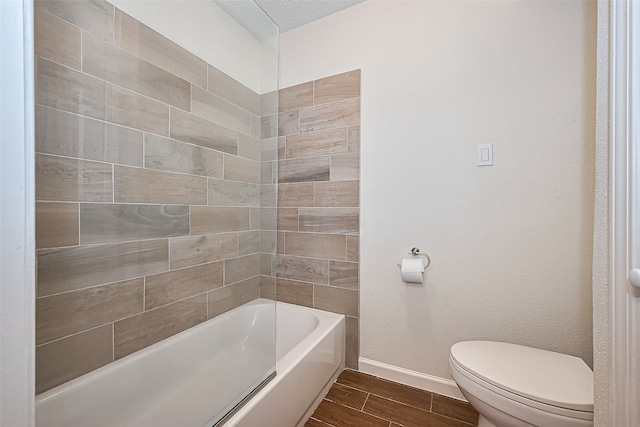 14811 El Miranda Dr, Houston, TX 77095 - full bath featuring toilet, a bathtub, wood finish floors, and baseboards