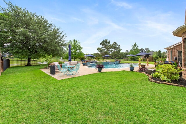 24818 Waterstone Estates Cir W, Tomball, TX 77375 - view of yard featuring a fenced backyard, a fenced in pool, and a patio