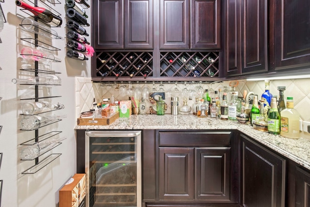 24818 Waterstone Estates Cir W, Tomball, TX 77375 - bar featuring a bar, wine cooler, and backsplash