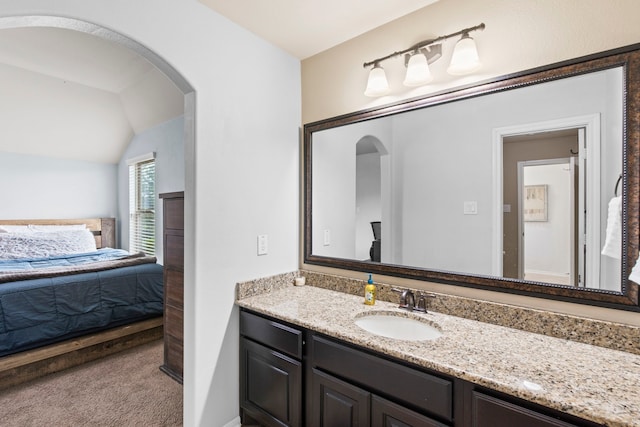 24818 Waterstone Estates Cir W, Tomball, TX 77375 - bathroom featuring vanity, ensuite bathroom, and lofted ceiling