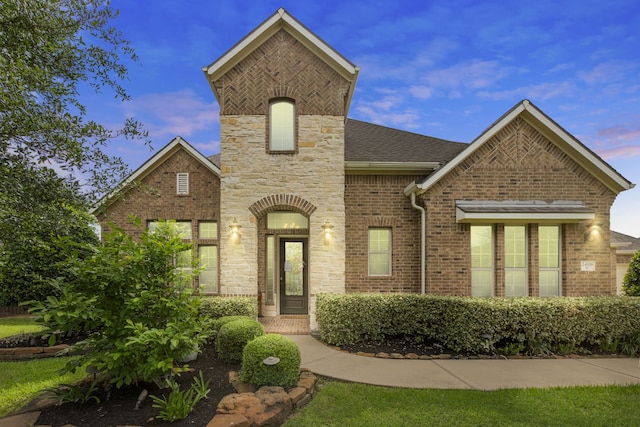 24818 Waterstone Estates Cir W, Tomball, TX 77375 - view of front of property featuring brick siding, stone siding, and roof with shingles