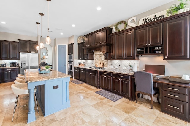 24818 Waterstone Estates Cir W, Tomball, TX 77375 - kitchen featuring stainless steel appliances, dark brown cabinetry, pendant lighting, and decorative backsplash
