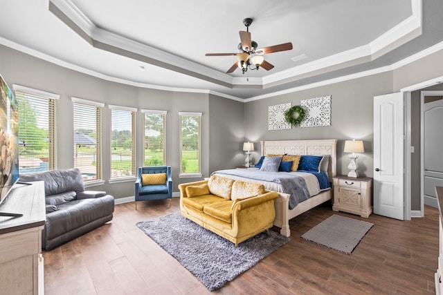 24818 Waterstone Estates Cir W, Tomball, TX 77375 - bedroom with crown molding, a raised ceiling, and wood finished floors