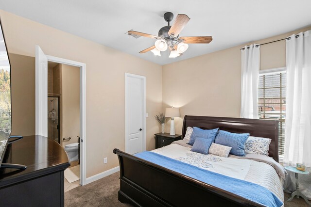 24818 Waterstone Estates Cir W, Tomball, TX 77375 - carpeted bedroom featuring baseboards, a ceiling fan, ensuite bath, and visible vents