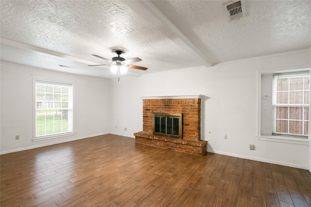 unfurnished living room with wood finished floors, a ceiling fan, a textured ceiling, and visible vents