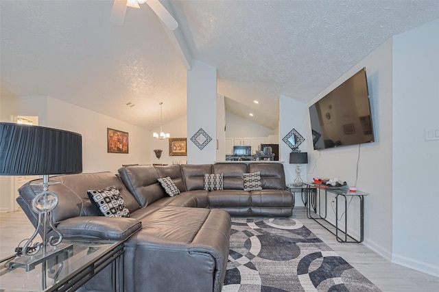 19944 Mountain Dale Dr, Cypress, TX 77433 - living area with a textured ceiling, a chandelier, vaulted ceiling, light wood-style floors, and ceiling fan