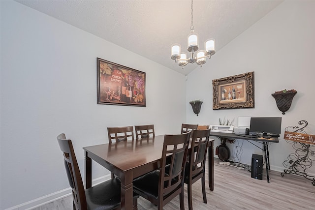 19944 Mountain Dale Dr, Cypress, TX 77433 - dining space featuring a chandelier, light wood finished floors, baseboards, and lofted ceiling
