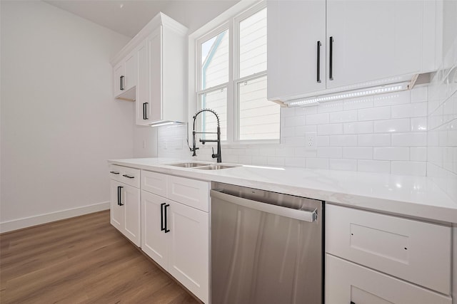 3114 Orange St, Houston, TX 77020 - kitchen featuring backsplash, dishwasher, a sink, white cabinets, and light wood-style floors