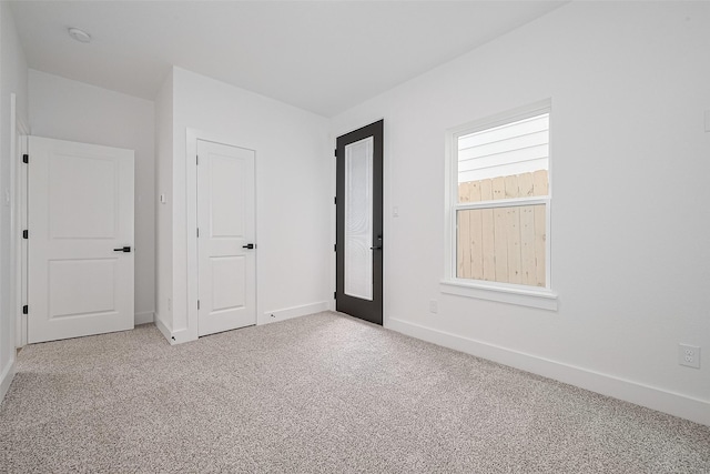 3114 Orange St, Houston, TX 77020 - carpeted empty room with baseboards